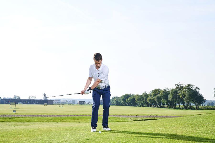 golf player on golf course ready for short game shot