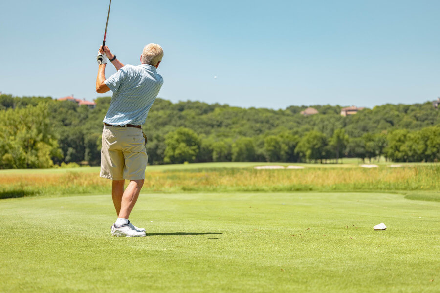 senior playing golf during daytime