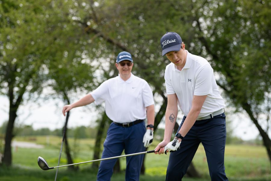 two golfers playing golf