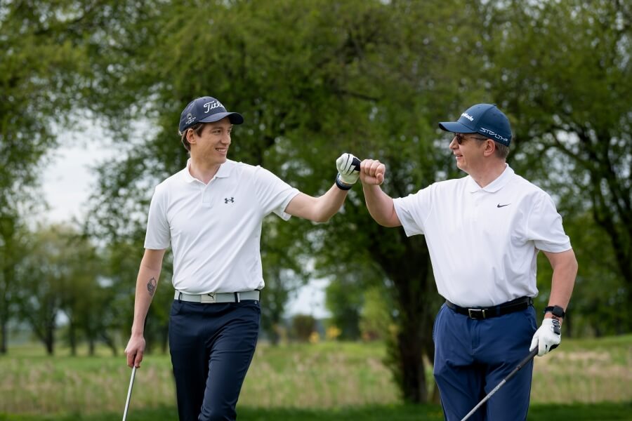 two happy golfers on the course